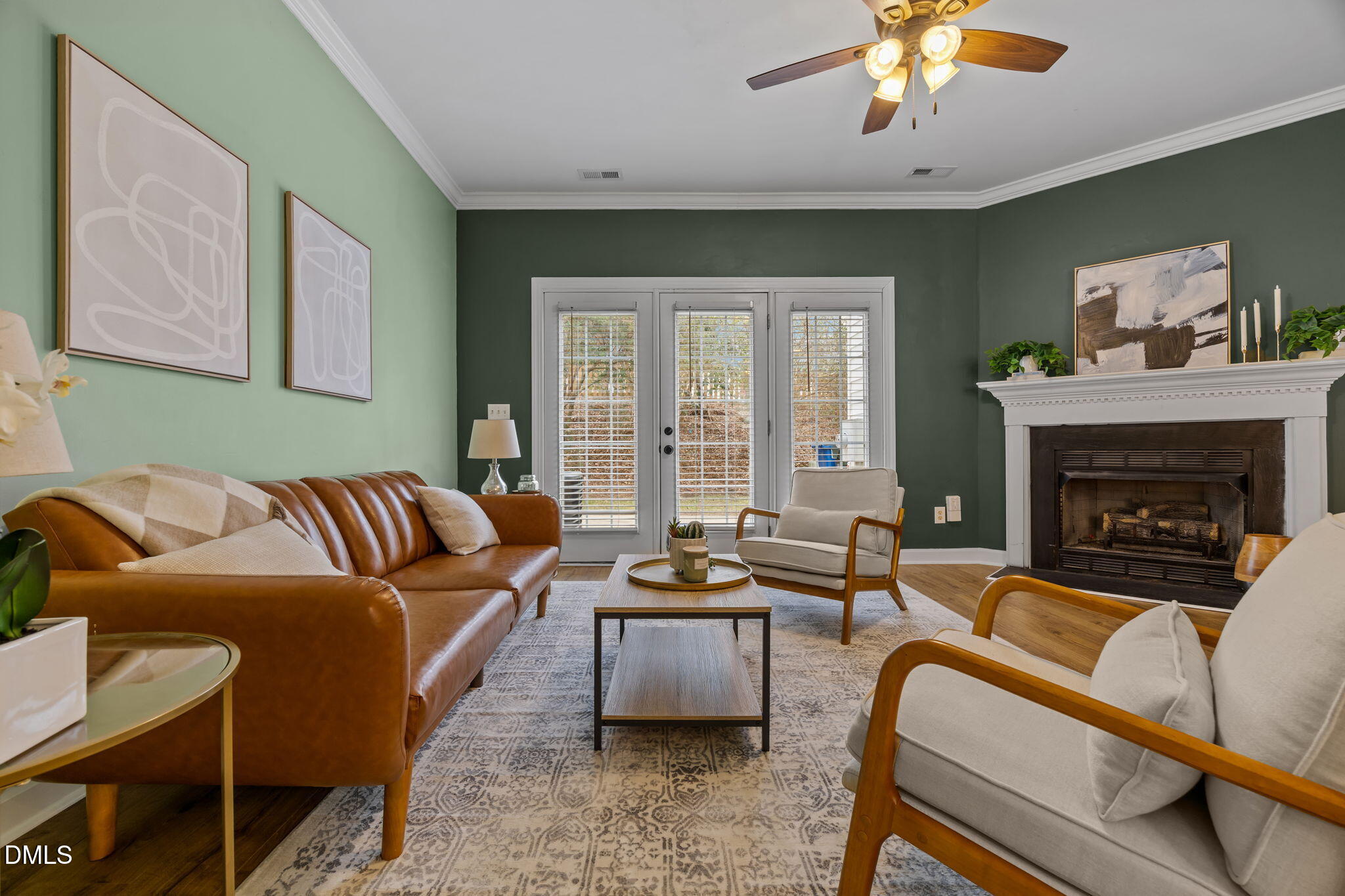 8606 London Park Court Raleigh, NC 27615 - Photo 23 of 29 a living room with furniture and a fireplace