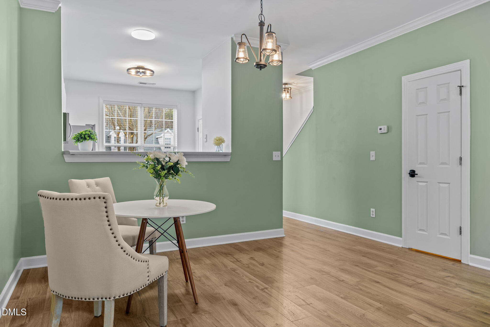 8606 London Park Court Raleigh, NC 27615 - Photo 24 of 29 a view of a room with furniture and wooden floor