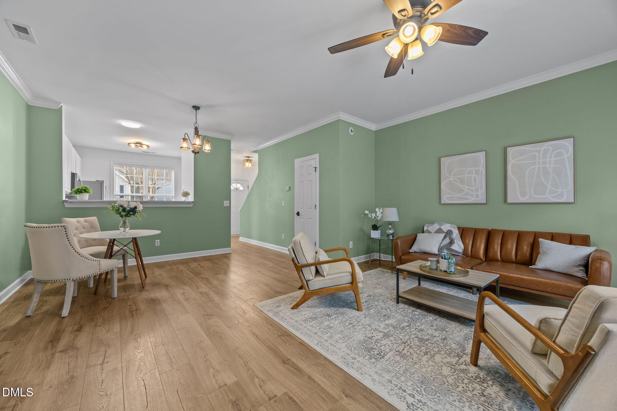 8606 London Park Court Raleigh, NC 27615 - Photo 9 of 29 a living room with furniture and a wooden floor