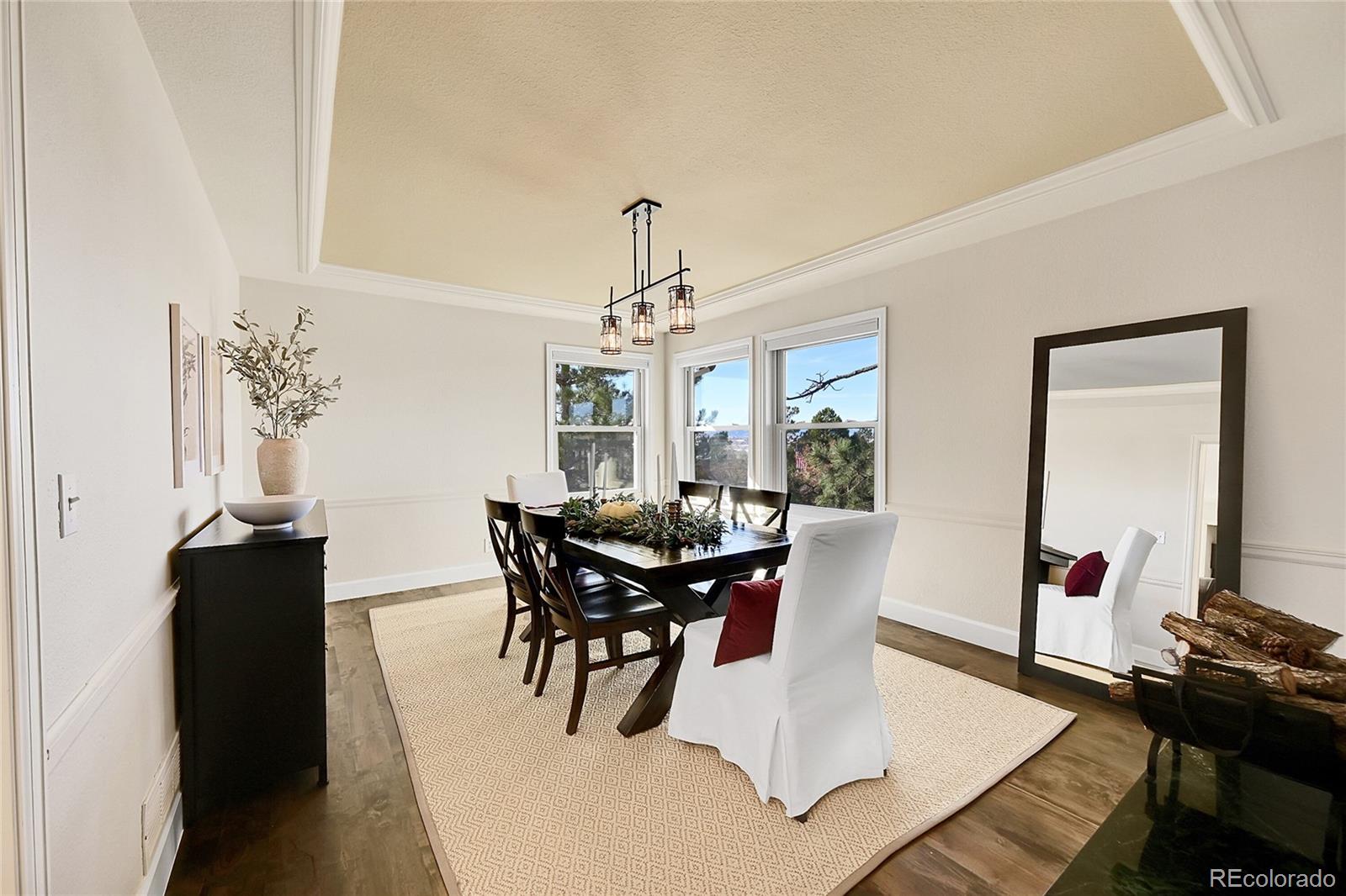 8717 Thunderbird Circle Parker, CO 80134 - Photo 11 of 50 a view of a dining room with furniture