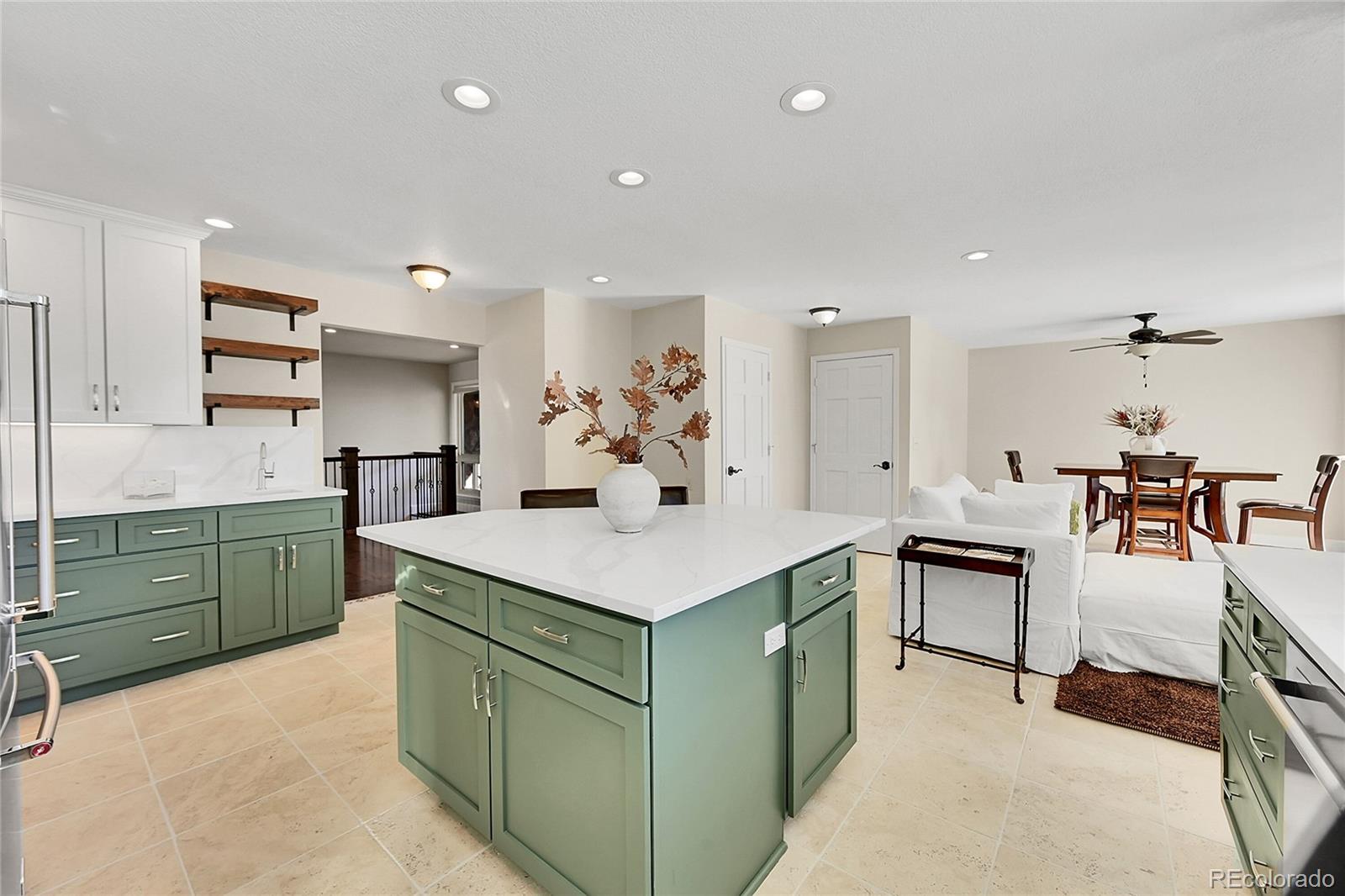 8717 Thunderbird Circle Parker, CO 80134 - Photo 17 of 50 a kitchen with a sink counter top space and cabinets