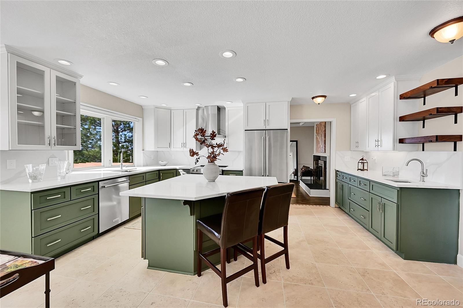 8717 Thunderbird Circle Parker, CO 80134 - Photo 19 of 50 a kitchen with a sink cabinets and stainless steel appliances