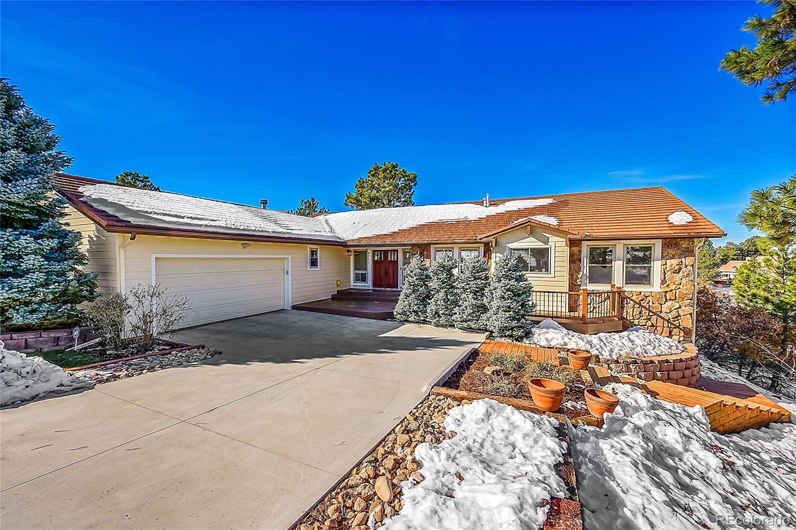 8717 Thunderbird Circle Parker, CO 80134 - Photo 2 of 50 a front view of a house with a yard