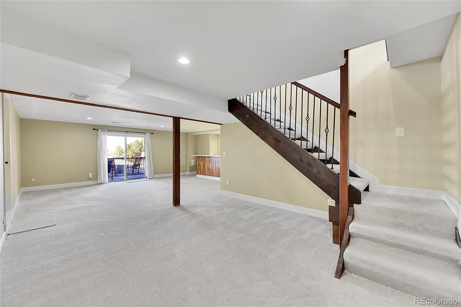 8717 Thunderbird Circle Parker, CO 80134 - Photo 31 of 50 a view of an empty room with wooden floor