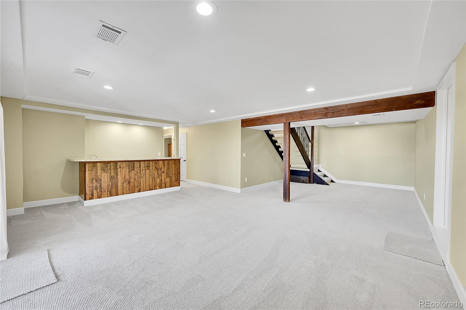 8717 Thunderbird Circle Parker, CO 80134 - Photo 33 of 50 an empty room with a wooden floor and white walls