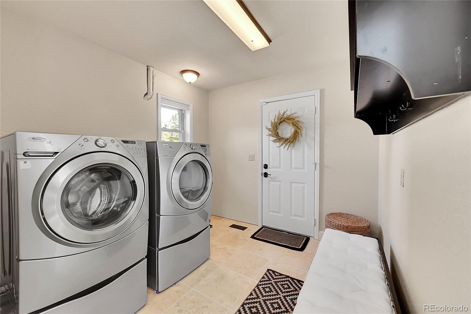 8717 Thunderbird Circle Parker, CO 80134 - Photo 38 of 50 a bedroom with a bed and a painting on the wall