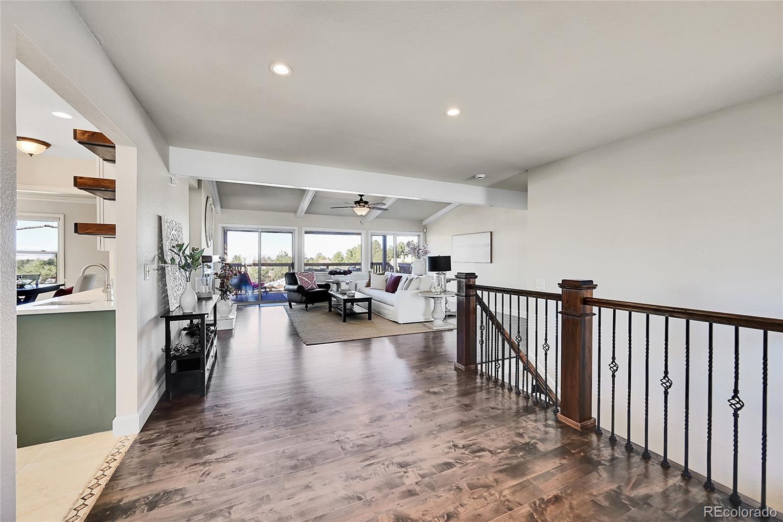 8717 Thunderbird Circle Parker, CO 80134 - Photo 4 of 50 a view of a living room and a livingroom with furniture kitchen view
