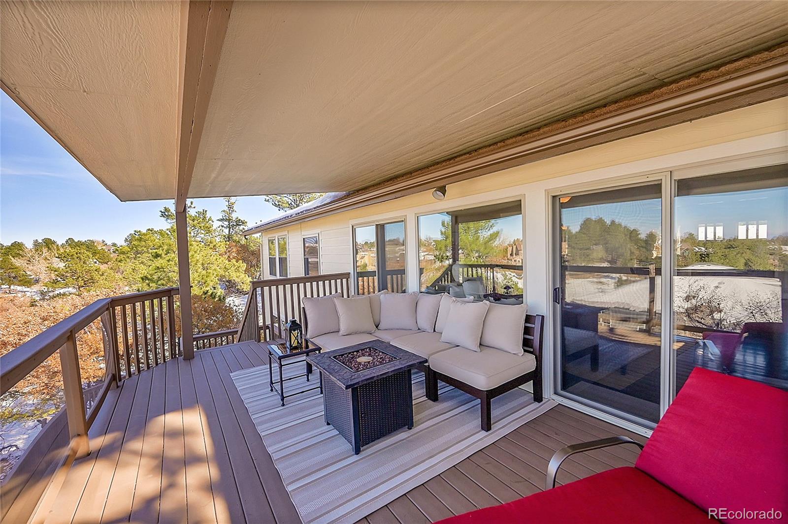 8717 Thunderbird Circle Parker, CO 80134 - Photo 42 of 50 a living room with furniture and a table