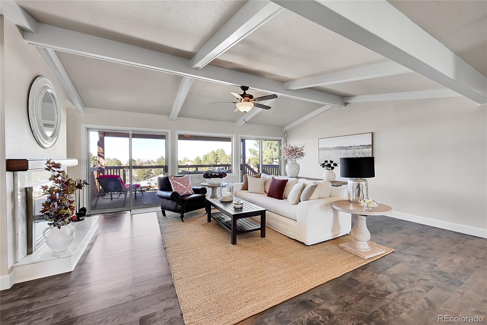 8717 Thunderbird Circle Parker, CO 80134 - Photo 5 of 50 a living room with furniture and wooden floor
