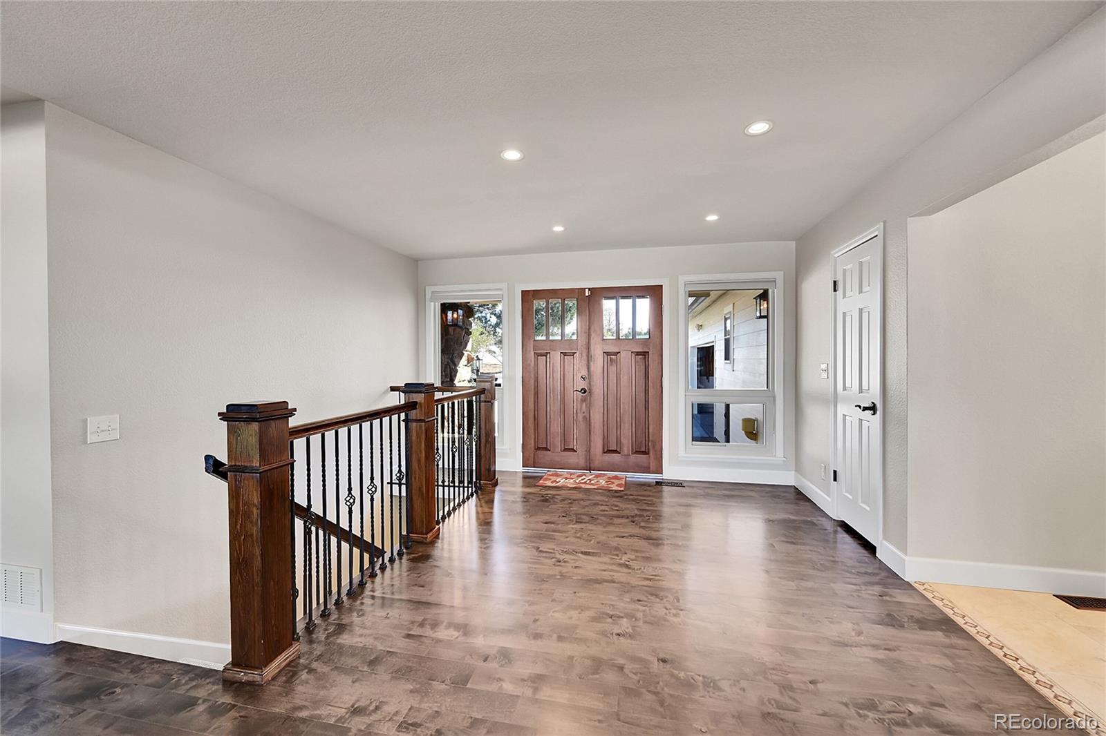 8717 Thunderbird Circle Parker, CO 80134 - Photo 6 of 50 a view of an entryway with wooden floor