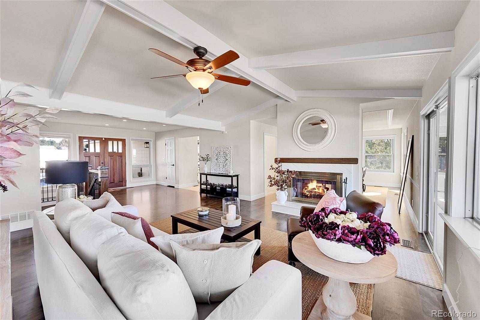 8717 Thunderbird Circle Parker, CO 80134 - Photo 7 of 50 a living room with furniture and a fireplace