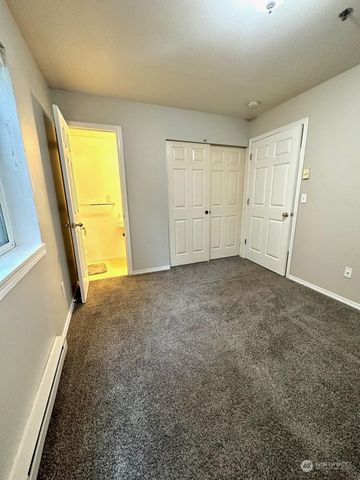 a view of an empty room and a window