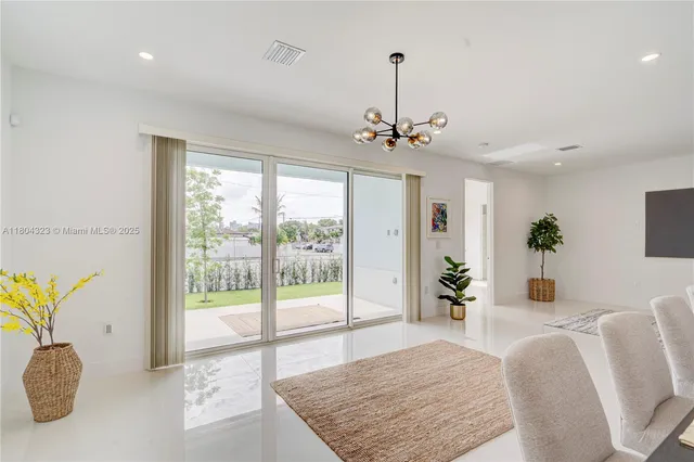 a kitchen with a sink a counter top space and stainless steel appliances