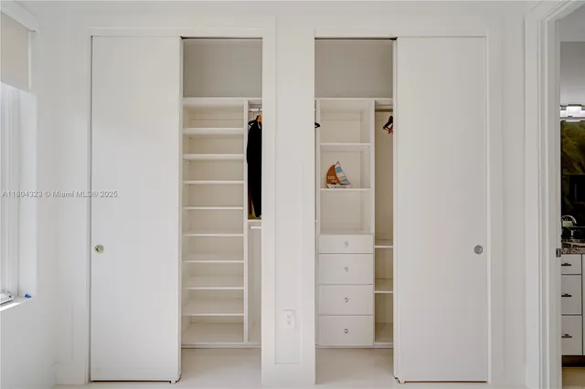 a white toilet sitting next to a shower