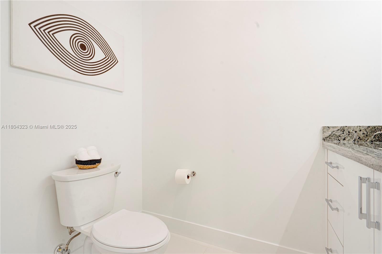 1805 Northwest 22nd Court Miami, FL 33125 - Photo 27 of 58 a white toilet sitting next to a shower