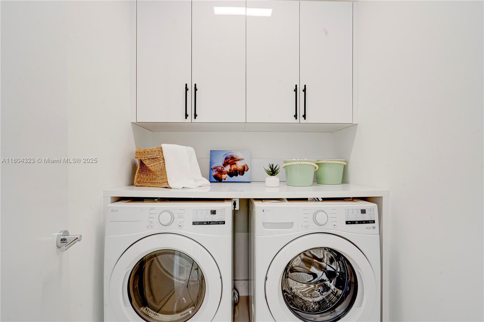 1805 Northwest 22nd Court Miami, FL 33125 - Photo 29 of 58 a utility room with dryer and washer