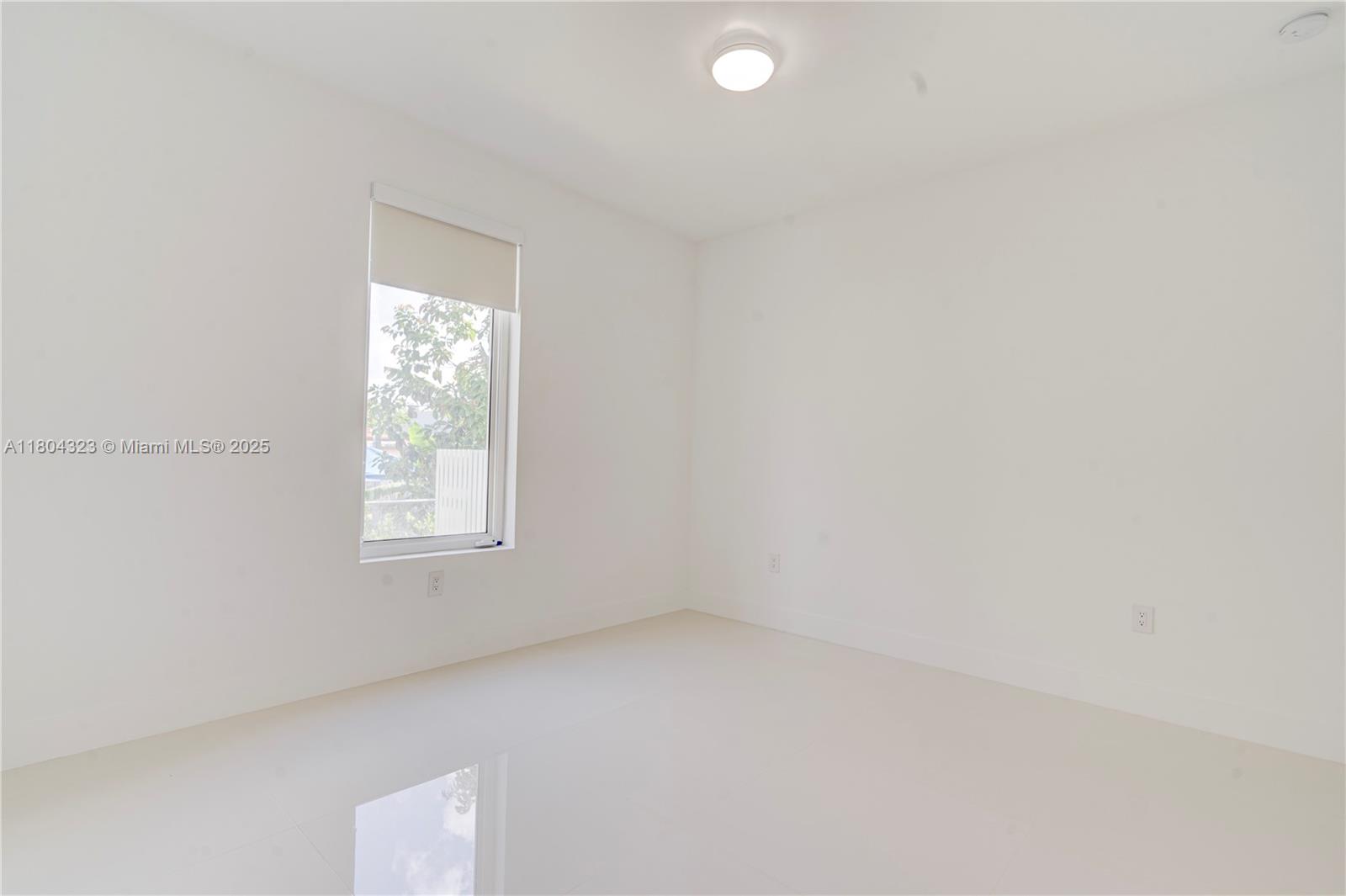 1805 Northwest 22nd Court Miami, FL 33125 - Photo 35 of 58 an empty room with a window