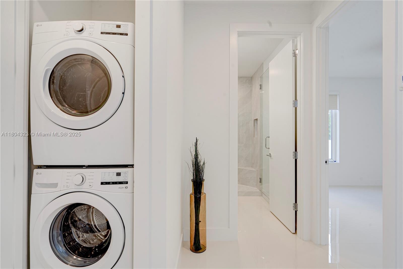 1805 Northwest 22nd Court Miami, FL 33125 - Photo 37 of 58 a view of a hallway with washer and dryer