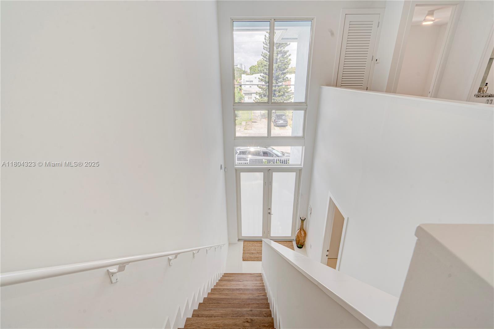 1805 Northwest 22nd Court Miami, FL 33125 - Photo 38 of 58 a hallway with windows and stairs