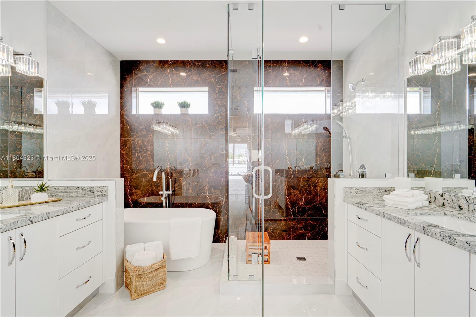 1805 Northwest 22nd Court Miami, FL 33125 - Photo 46 of 58 a bathroom with a double vanity sink mirror and shower