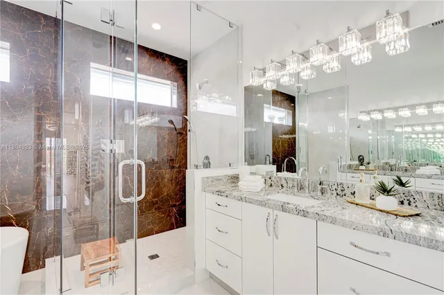 an empty room with wooden floor and entrance