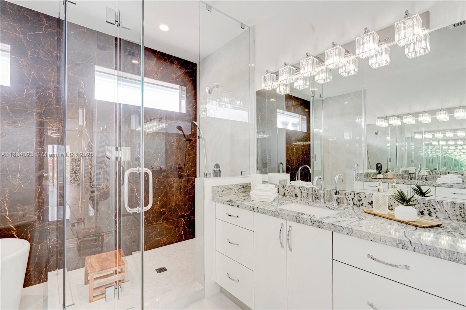 1805 Northwest 22nd Court Miami, FL 33125 - Photo 48 of 58 a bathroom with a double vanity sink mirror and double