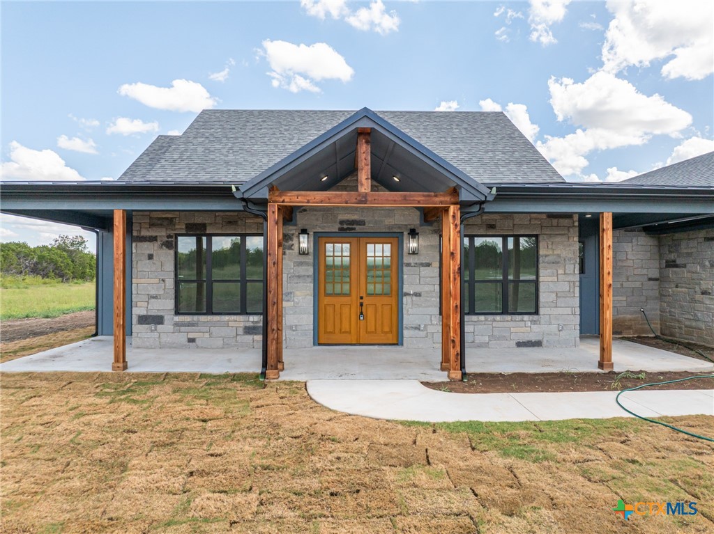 237 Cedar Bluff Loop Gatesville, TX 76528 - Photo 24 of 31 a view of a brick house with a outdoor space