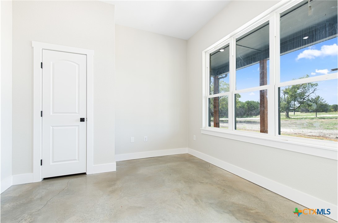 237 Cedar Bluff Loop Gatesville, TX 76528 - Photo 4 of 31 an empty room with windows