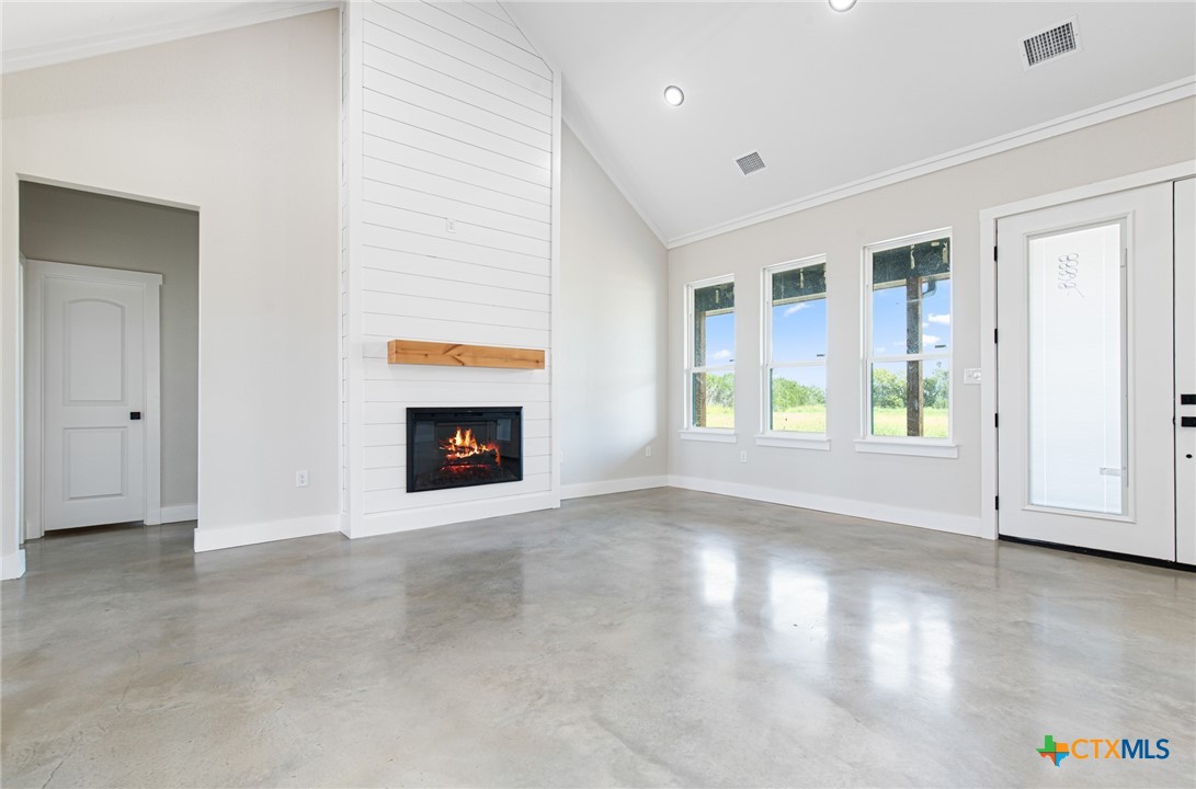 237 Cedar Bluff Loop Gatesville, TX 76528 - Photo 5 of 31 a view of an empty room with window and fire place