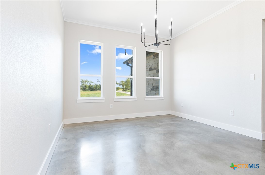 237 Cedar Bluff Loop Gatesville, TX 76528 - Photo 8 of 31 a view of empty room with wooden floor and fan