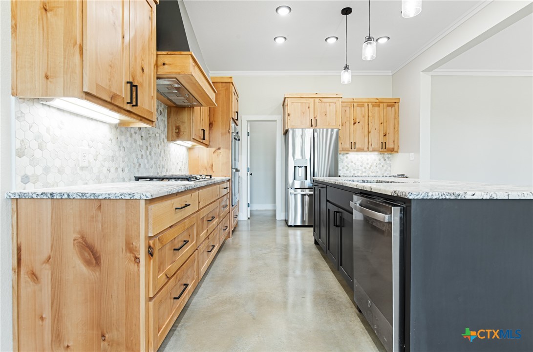 237 Cedar Bluff Loop Gatesville, TX 76528 - Photo 9 of 31 a kitchen with stainless steel appliances granite countertop a stove a sink and a refrigerator