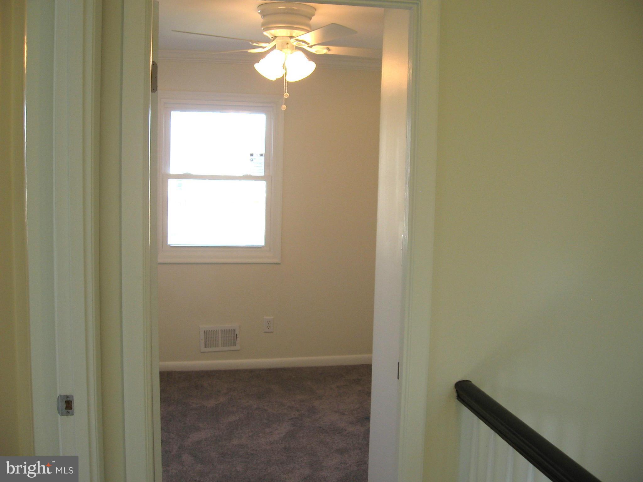8245 Del Haven Road Baltimore, MD 21222 - Photo 12 of 29 a view of an empty room with a window