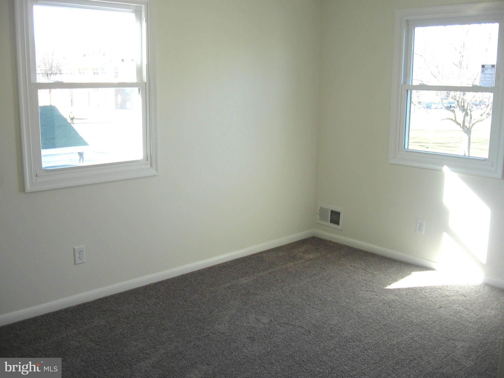 8245 Del Haven Road Baltimore, MD 21222 - Photo 13 of 29 an empty room with a window