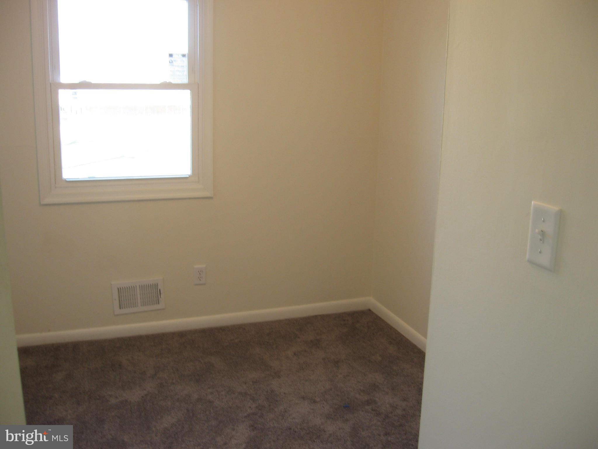 8245 Del Haven Road Baltimore, MD 21222 - Photo 14 of 29 an empty room with a window
