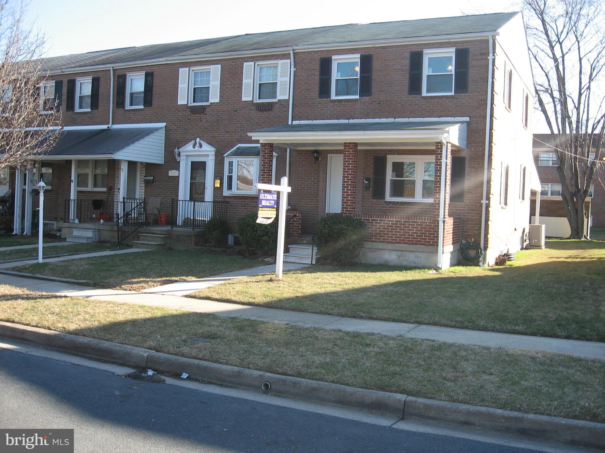 8245 Del Haven Road Baltimore, MD 21222 - Photo 24 of 29 a front view of a house with garden