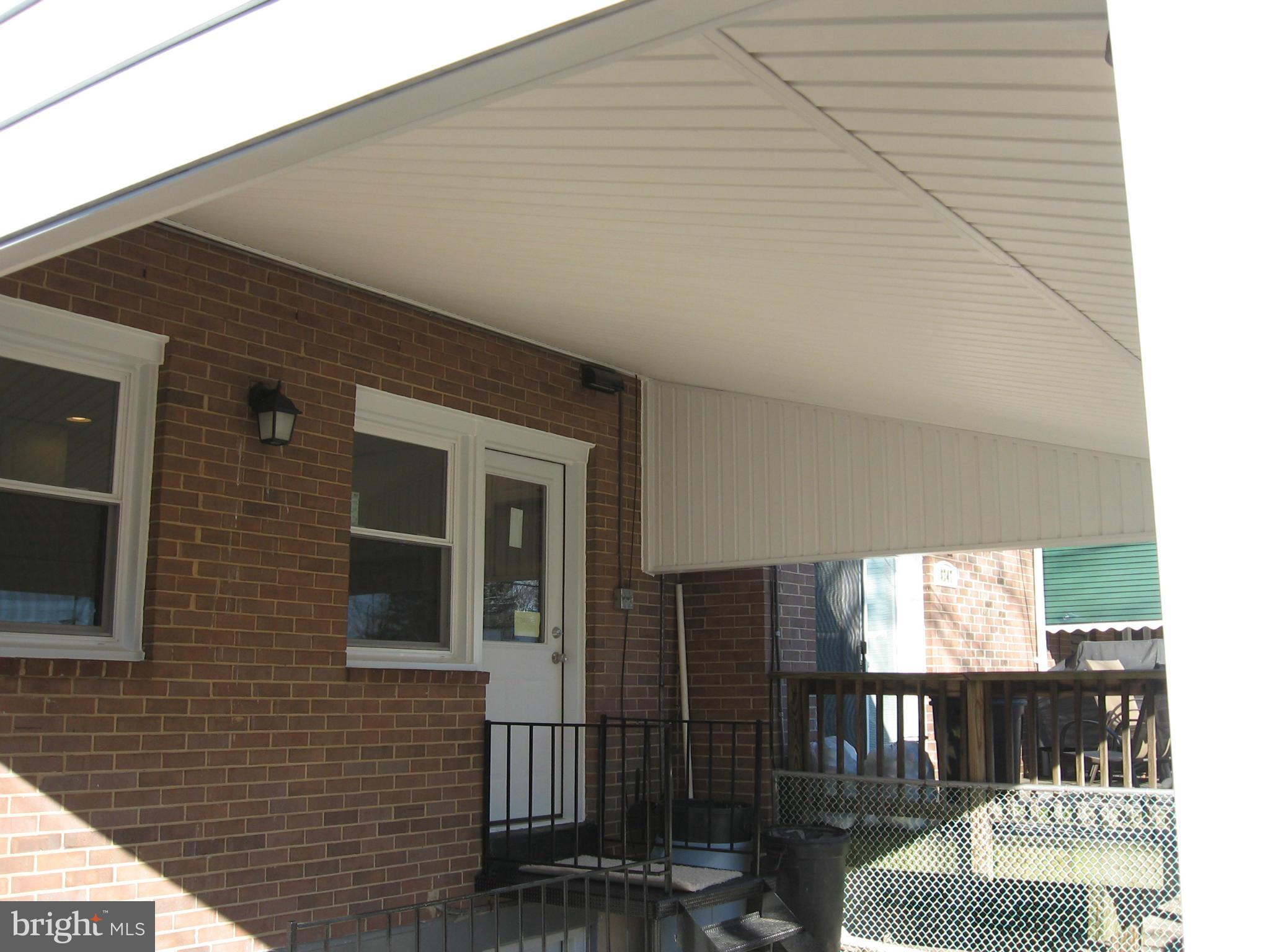 8245 Del Haven Road Baltimore, MD 21222 - Photo 26 of 29 a view of a brick house with many windows
