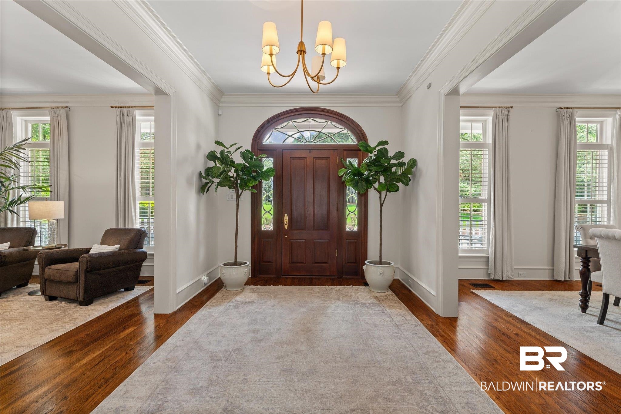 8561 Dawes Lake Road Mobile, AL 36619 - Photo 3 of 63 Foyer entrance featuring hardwood / wood-style flooring, a chandelier, and ornamental molding