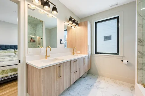 a bathroom with a sink and a mirror