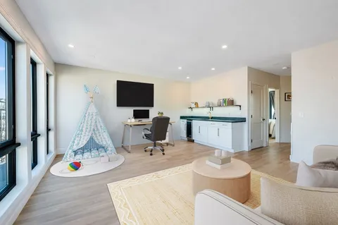 a room with furniture and a flat screen tv