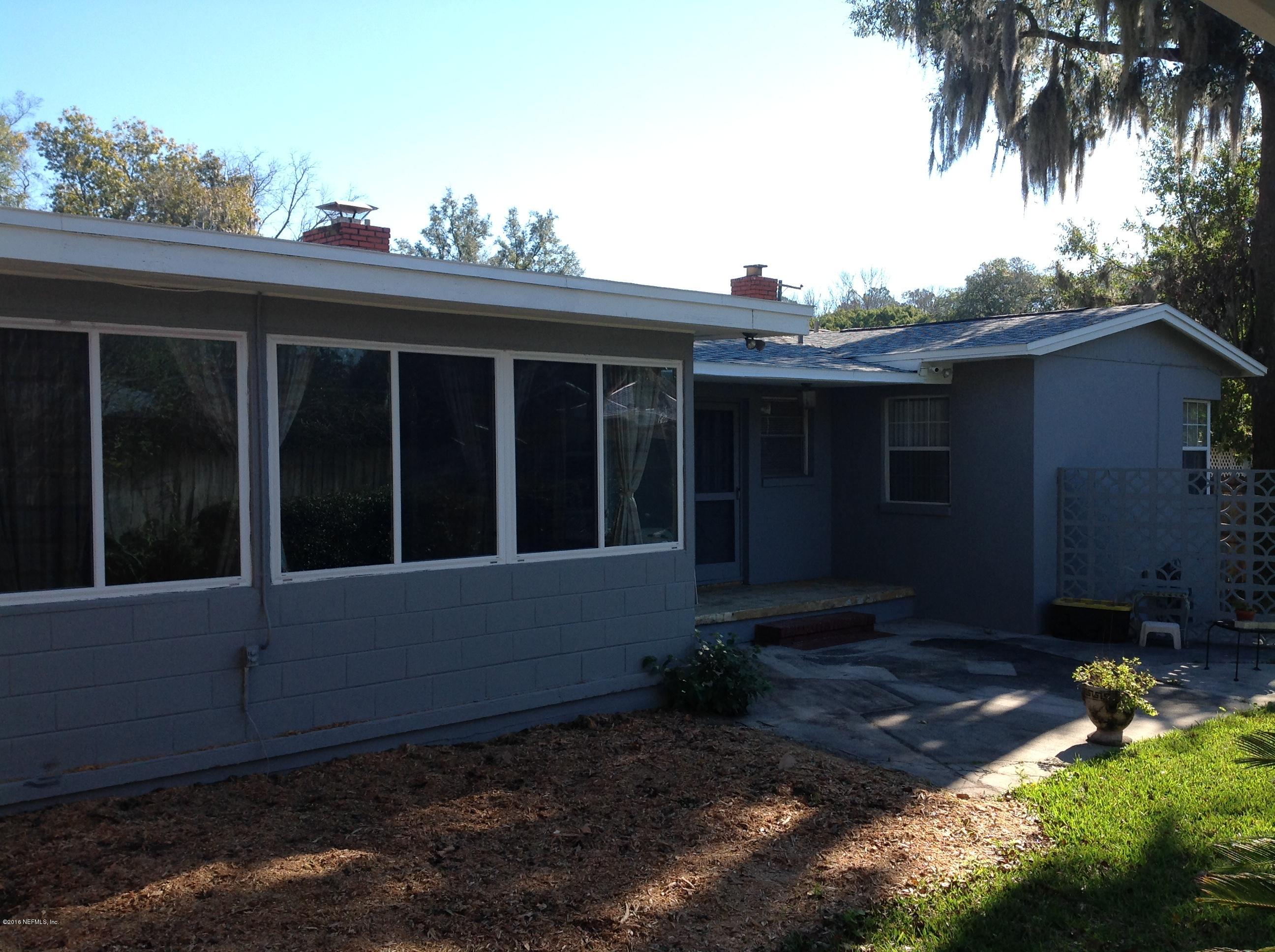 6426 Wesleyan Road Jacksonville, FL 32217 - Photo 2 of 4 a view of house with backyard and outdoor seating