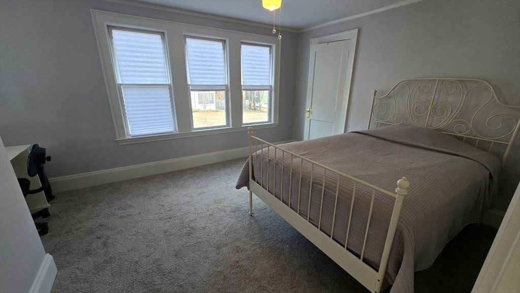 34 Lafayette Street Marblehead, MA 01945 - Photo 15 of 22 a bedroom with a bed and a window