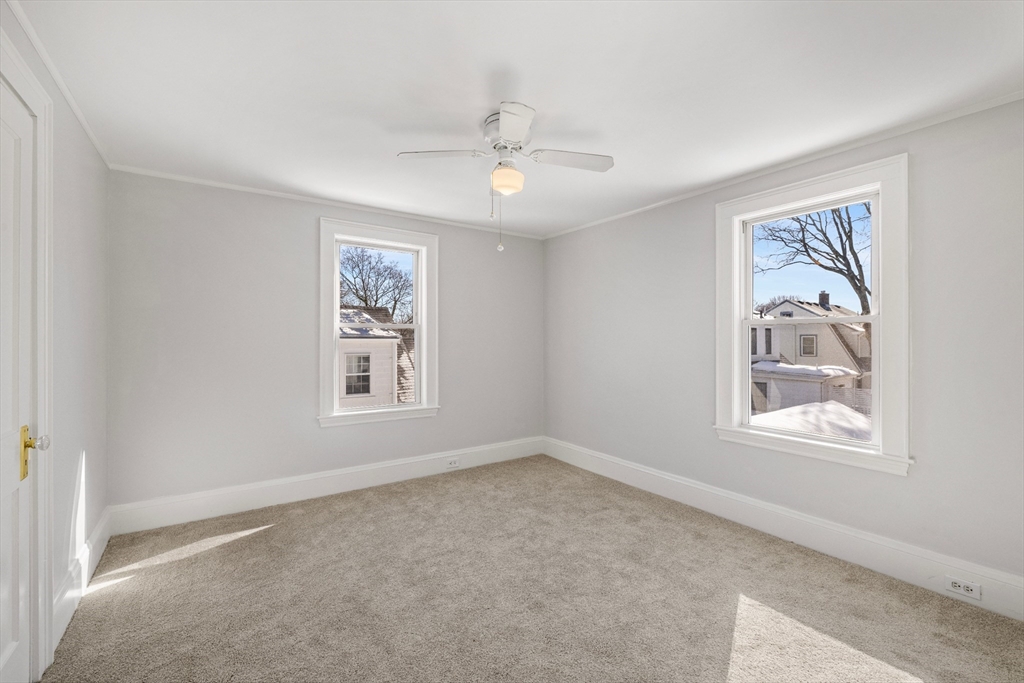 34 Lafayette Street Marblehead, MA 01945 - Photo 17 of 22 an empty room with windows and fan
