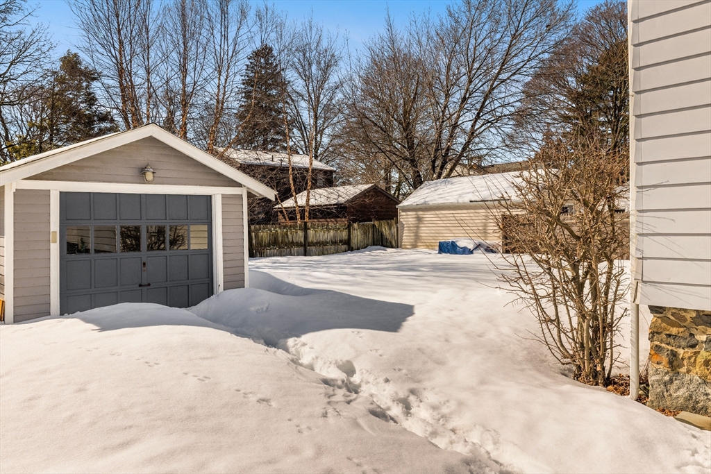 34 Lafayette Street Marblehead, MA 01945 - Photo 21 of 22 a view of a white house with a yard covered in snow
