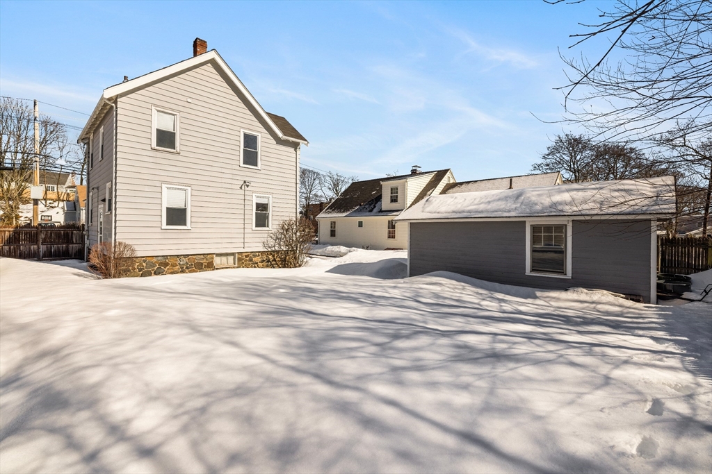 34 Lafayette Street Marblehead, MA 01945 - Photo 22 of 22 a view of a house with a snow in the yard
