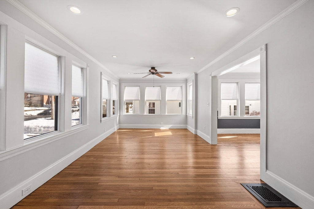 34 Lafayette Street Marblehead, MA 01945 - Photo 3 of 22 a view of an empty room with window and wooden floor