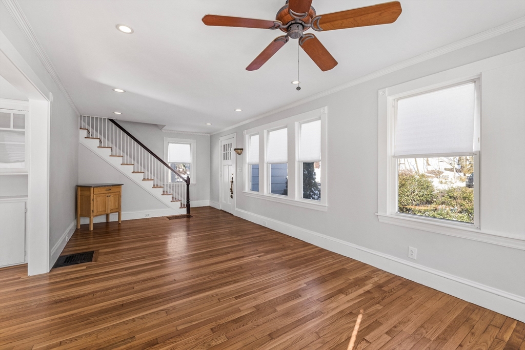 34 Lafayette Street Marblehead, MA 01945 - Photo 4 of 22 a view of an empty room with wooden floor and a window