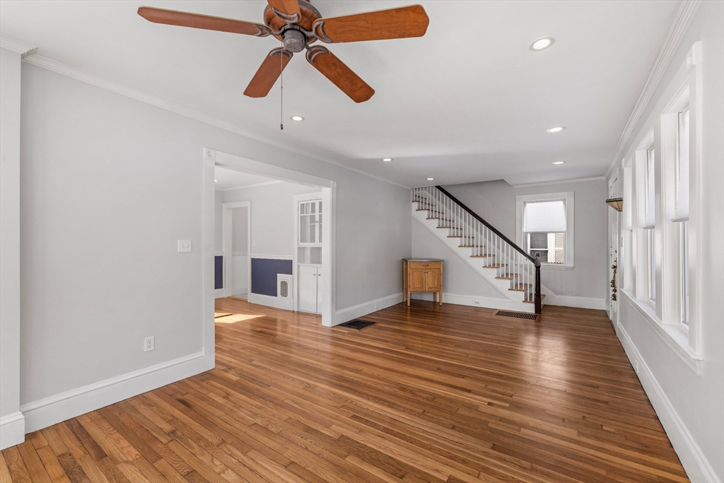34 Lafayette Street Marblehead, MA 01945 - Photo 6 of 22 an empty room with wooden floor fan and windows