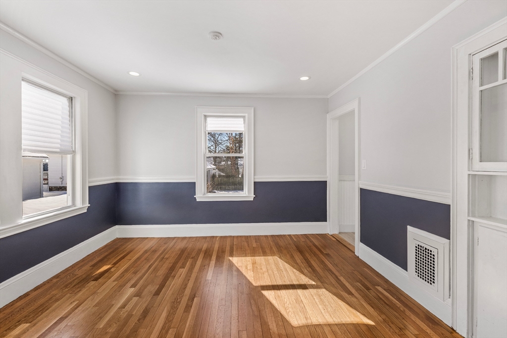 34 Lafayette Street Marblehead, MA 01945 - Photo 8 of 22 a view of wooden floor in an empty room with a window