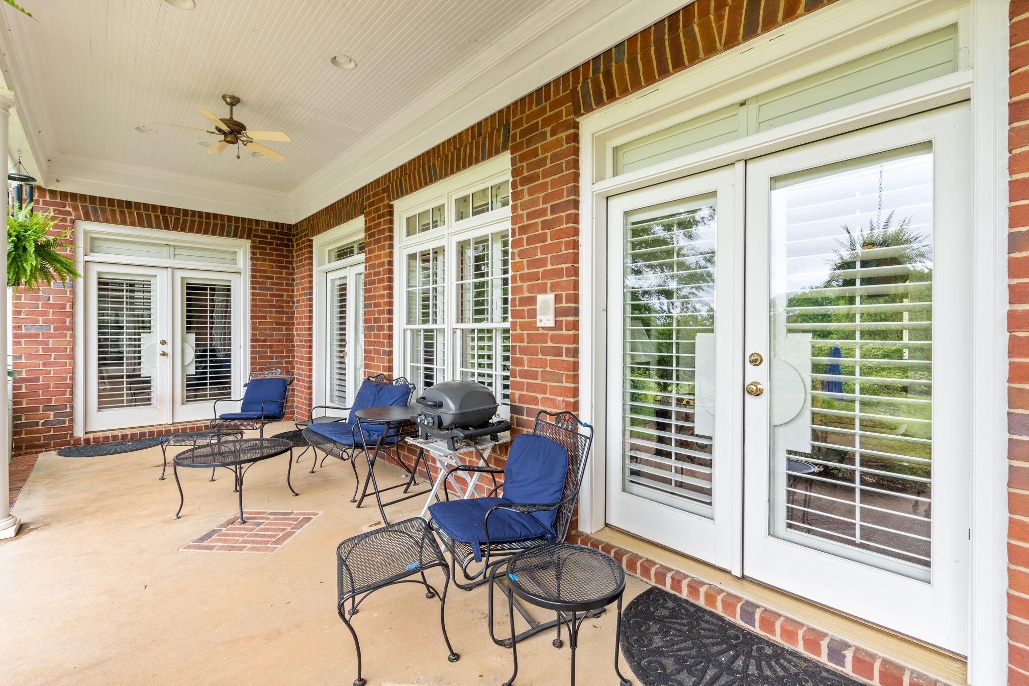 3210 Kinnard Springs Road Franklin, TN 37064 - Photo 46 of 64 a living room with furniture and floor to ceiling windows