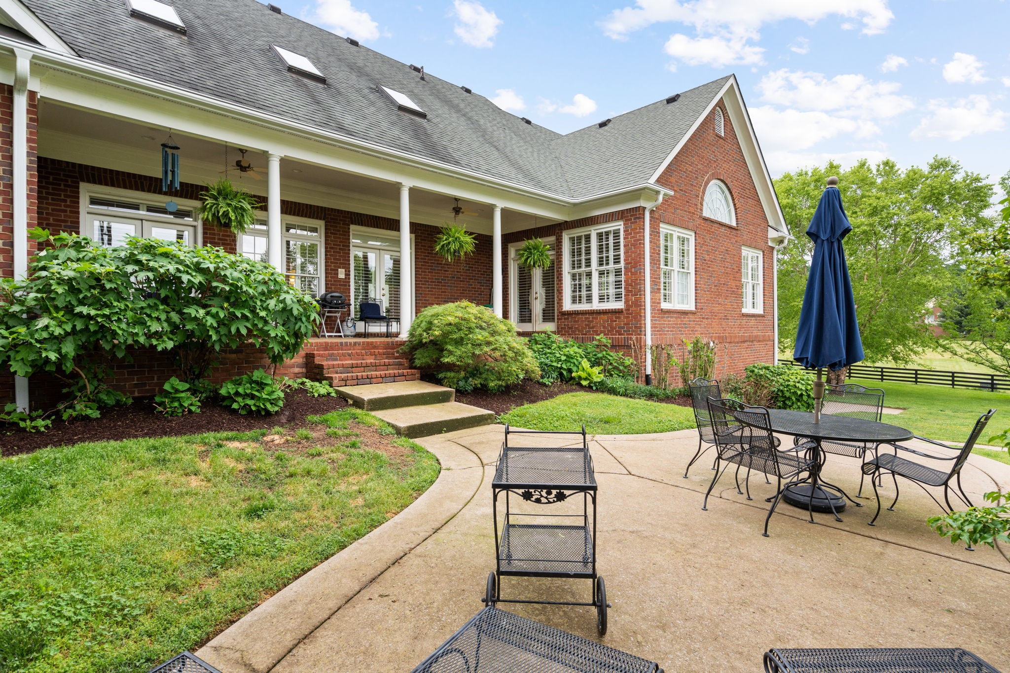 3210 Kinnard Springs Road Franklin, TN 37064 - Photo 49 of 64 a view of a house with backyard sitting area and garden